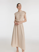 a lady in beige acetate gathered waist maxi dress with pockets